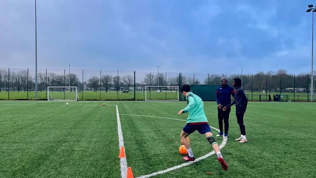 Outdoor football training session on artificial pitch